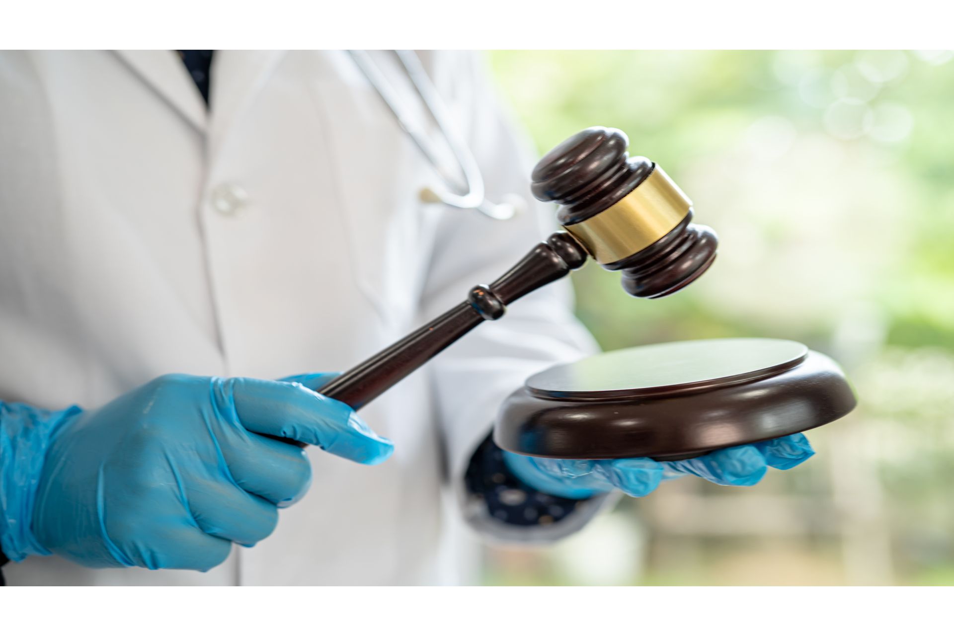 doctor-holding-judge-gavel-forensic-medicine-med-2023-11-28-04-44-03-utc (1).jpg